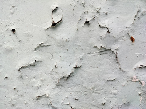 causes of peeling wall paint
